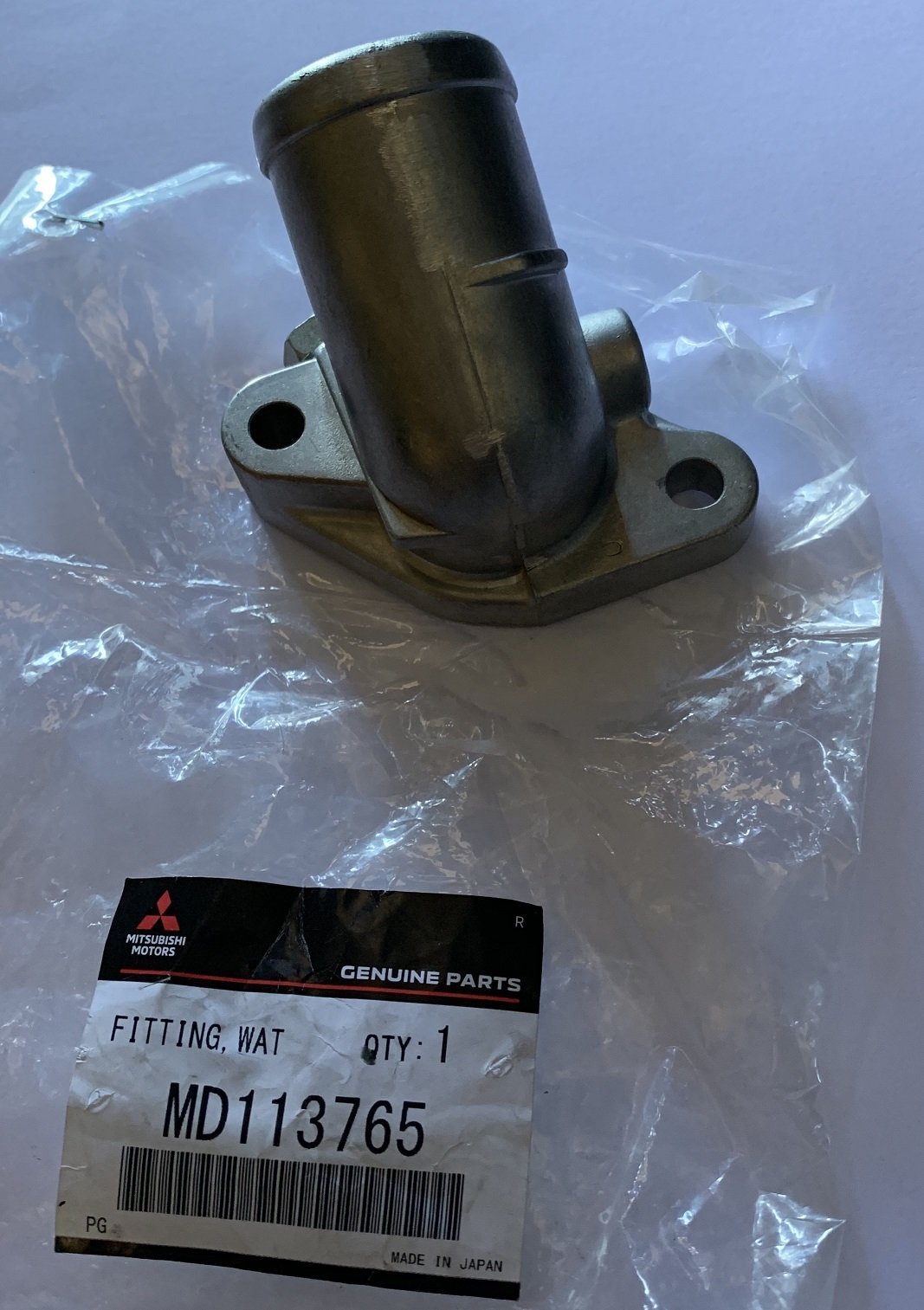 FLANGIA TERMOSTATO/ RACCORDO USCITA ACQUA MITSUBISHI PAJERO I (ORIGINALE) - Autoricambi4x4